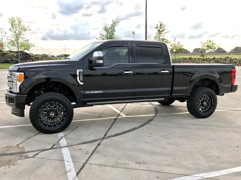 2017 Ford F 250 Super Duty With 2 Inch Rough Country Leveling Spacers Hostile Sprocket Blade Cut 20x9 +0 Offset 20 By 9 Inch Wide Wheel Nitto Terra Grappler G2 295 65r20 Tire 